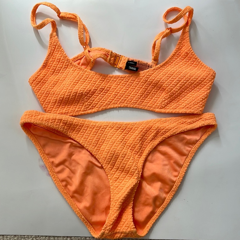 Orange triangl bikini. Size extra small top and size small bottoms.